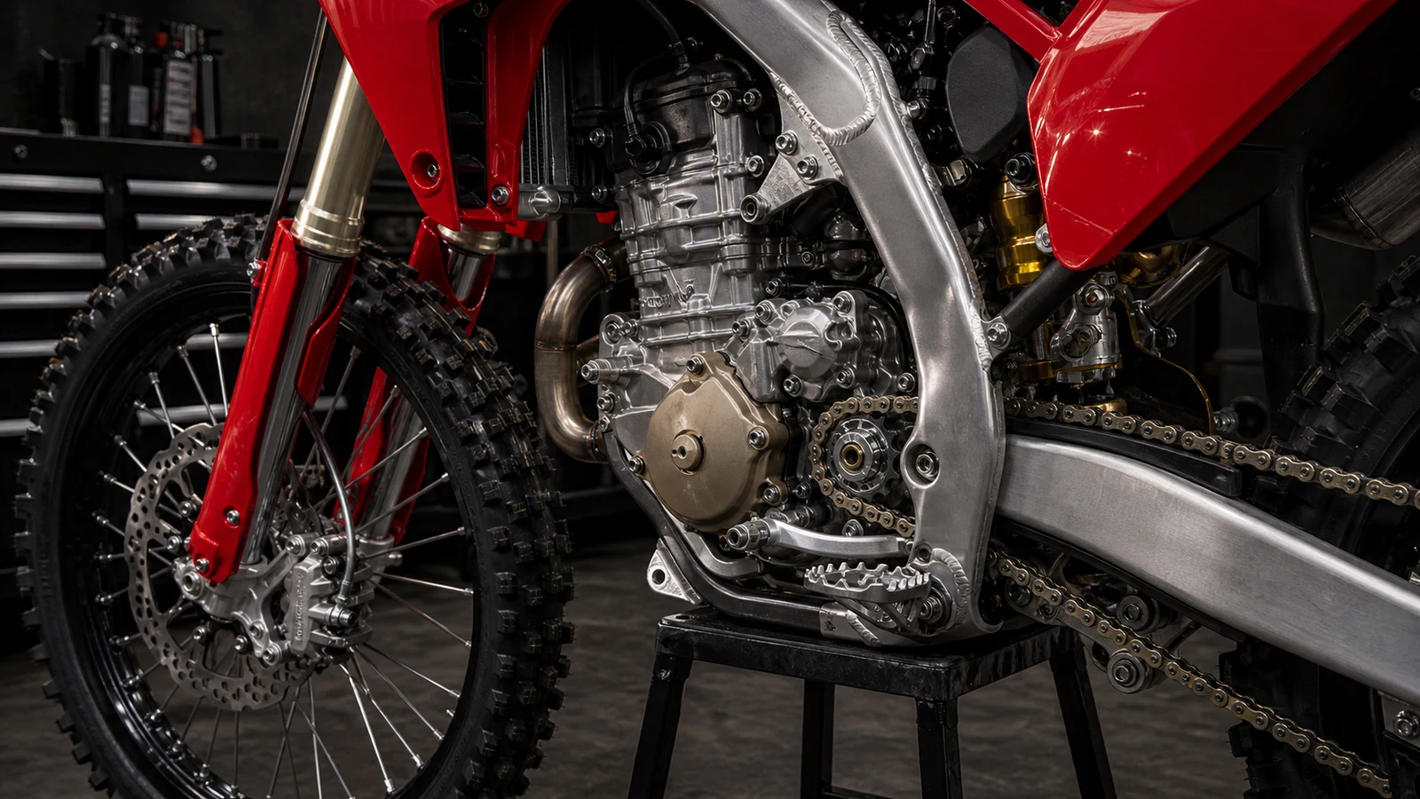 AI-generated Ducati Desmo450 MX engine detail showing 449.6cc desmodromic single, aluminium frame and chain drive