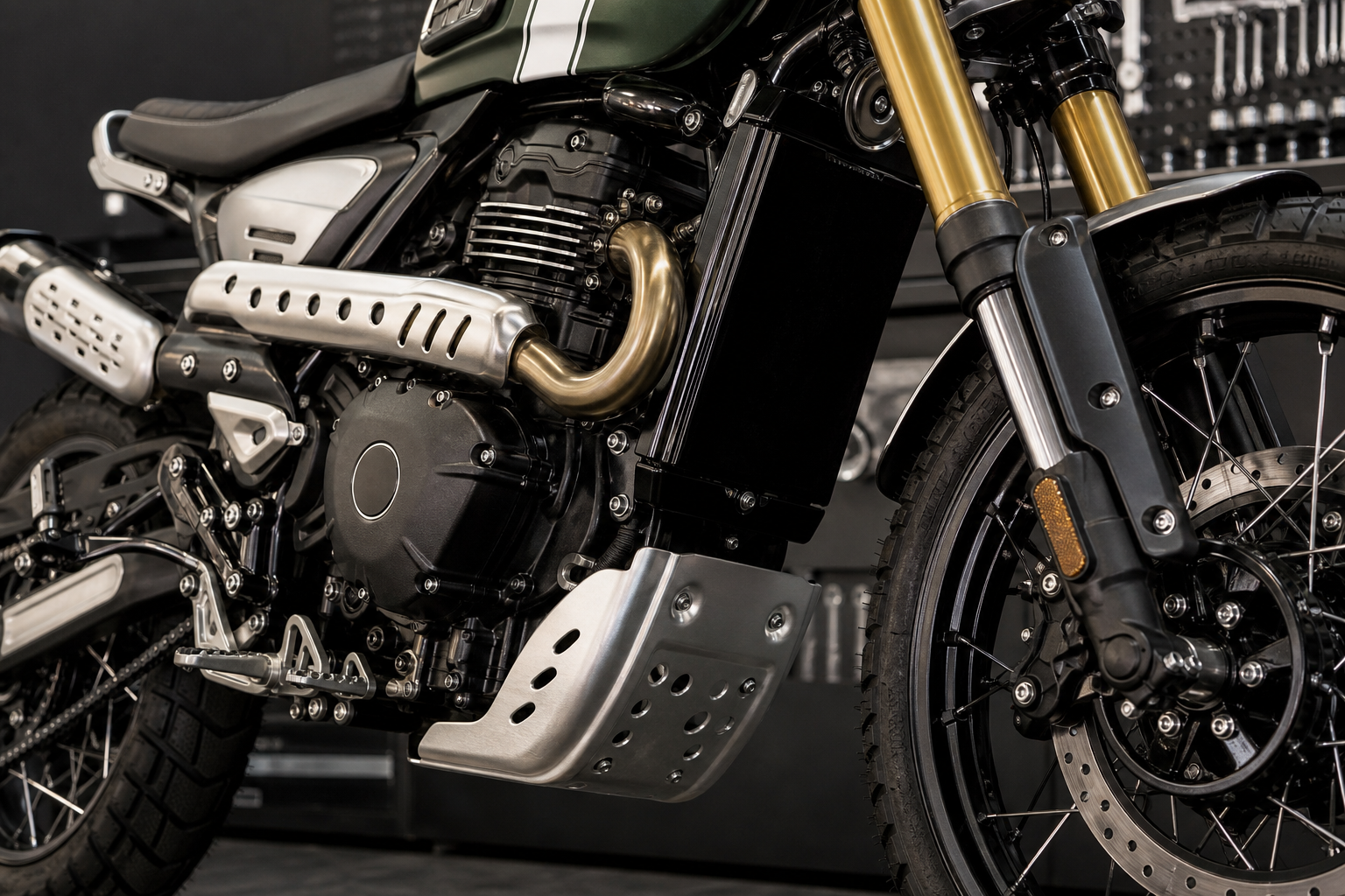 Triumph Scrambler 400 X 398cc engine fork brake and scrambler tire detail in an industrial inspection bay